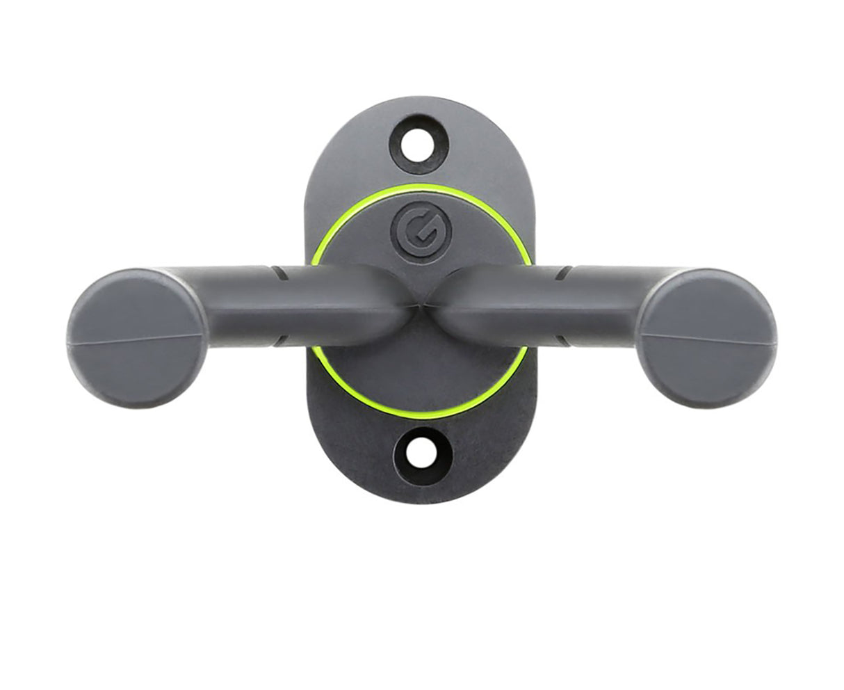 Gravity wall mounted guitar holder