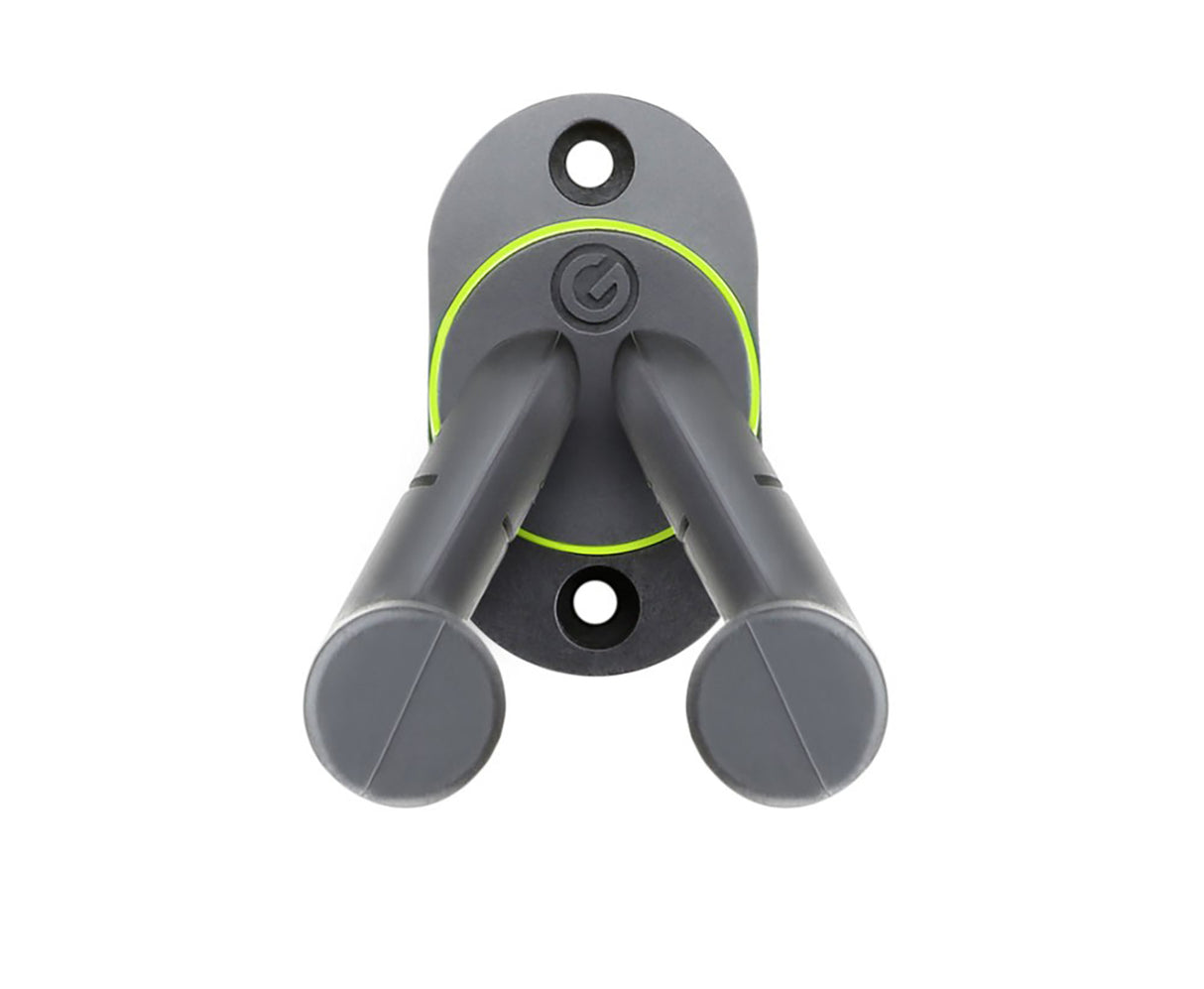 Gravity wall mounted guitar holder