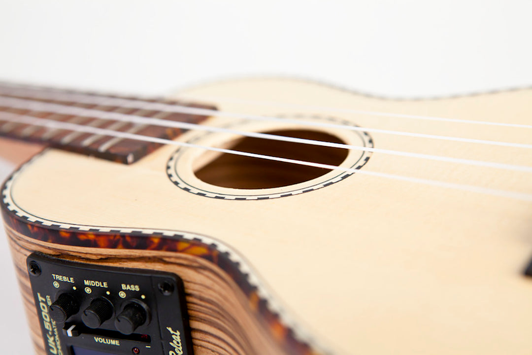 Reno RU210E Soprano Ukeleles con Pickup y Afinador (Natur)